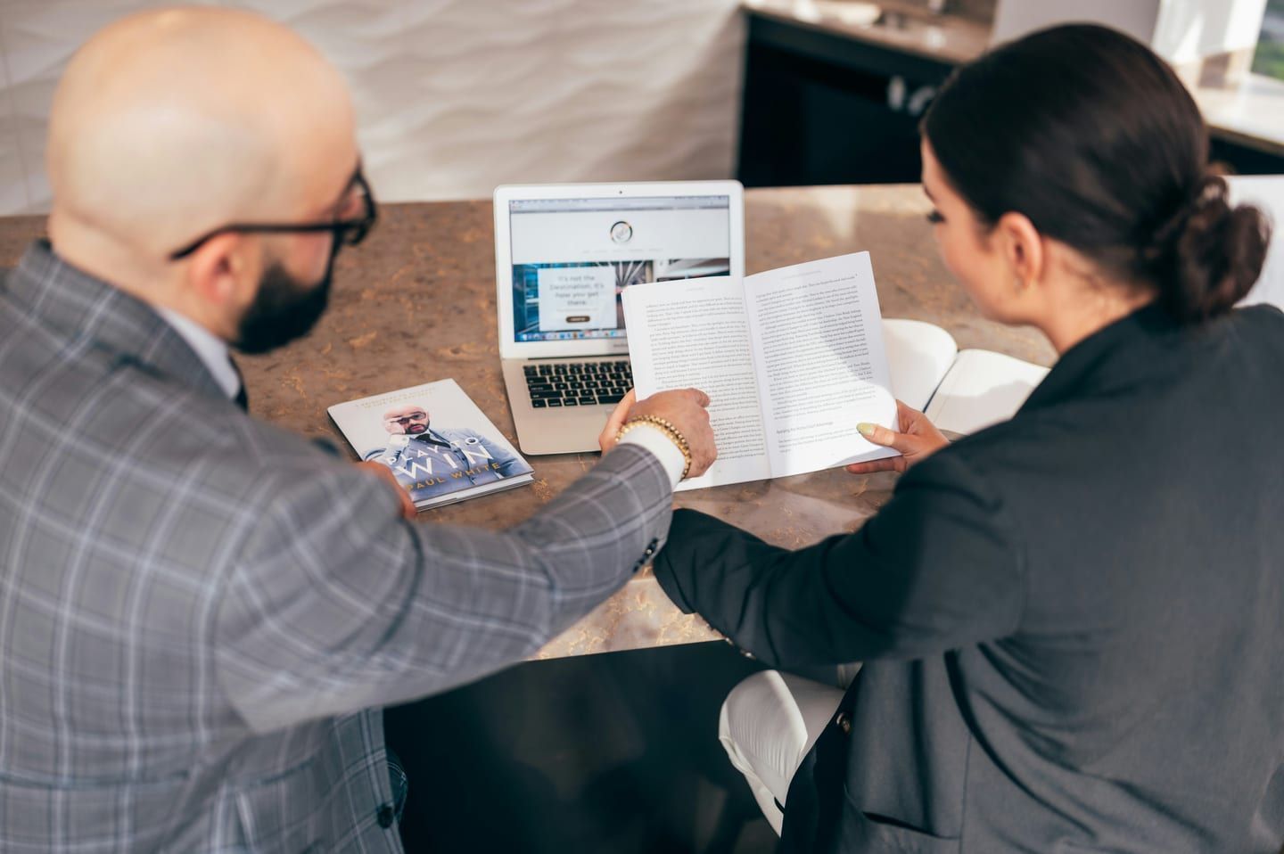 An installer reviewing rebate eligibility with a homeowner