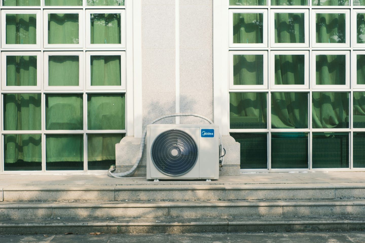 A multi-zone outdoor condenser serving several heads